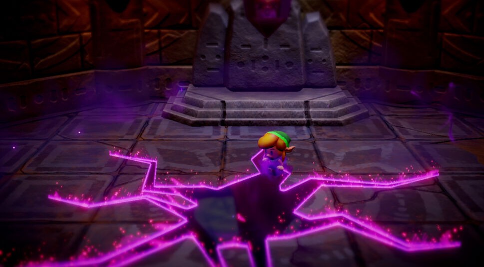 Das BIld zeigt einen Screenshot aus dem Nintendo Switch-Spiel "The Legend of Zelda: Echoes of Wisdom".- Zu sehen ist ein dunkler Raum mit Steinwänden und -böden. Der Boden scheint einzureißen und ein dunkles Loch erscheint, umrandet von einer pink-leuchtenden Kante.