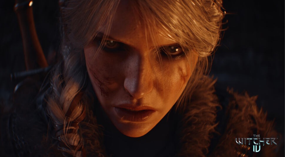 Auf dem Bild zu The Witcher 4 ist eine Nahaufnahme von Ciri zu sehen. Ihr Gesicht zeigt Schmutz und Kratzer, was auf eine intensive Auseinandersetzung hindeutet. Ihr silbernes Haar ist zu einem Zopf gebunden, und ihre entschlossenen, durchdringenden Augen blicken direkt in die Kamera. Die Szene ist in warmem Licht gehalten, das einen dramatischen und intensiven Ton vermittelt.