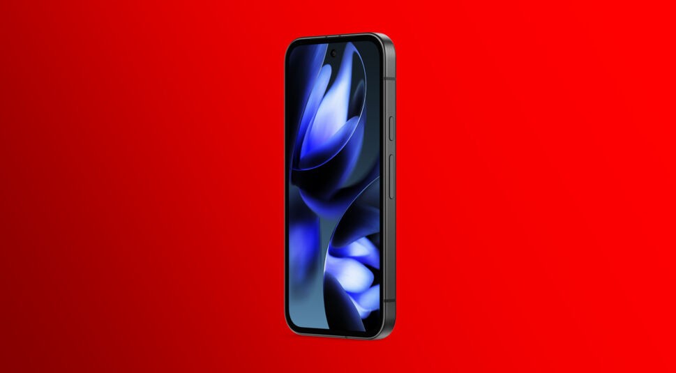 Auf dem Bild ist das Google Pixel 9a von vorn in einer schrägen Seitenansicht vor einem kräftig roten Hintergrund zu sehen. Deutlich sichtbar sind das Display mit bläulich-violettem Wallpaper und die seitlichen Tasten für Lautstärke und Power. Das Google Pixel 9a wirkt kantig und hochwertig im Design.