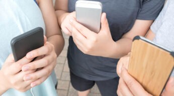 Virtual Reality Mobile Gaming Friends and Family Playing with Smartphones