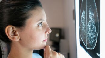 Female gynecologist looking at a mammogram very concerned