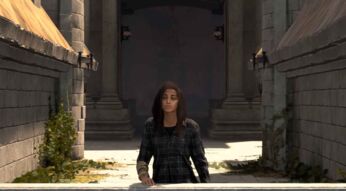 Frey steht auf dem Balkon eines alten Bauwerks und schaut sich die Welt von FORSPOKEN an