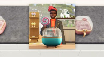 Ein Sim steht in „Sims 4“ vor einer Küchenmaschine und hat einen Lolli in der Hand.