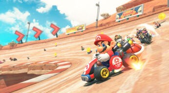 Auf dem Bild in dem Artikel zum Mario Kart World-Test führt Mario das Rennen auf einer Rennstrecke an. Er sitzt in einem roten Kart. Hinter ihm folgen weitere bekannte Fahrer:innen. Goldene Münzen und Streckenhinweise unterstreichen das typische Mario-Kart-Design.