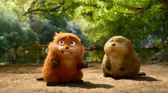 In dieser Szene aus dem neuen Pixar-Film Hoppers sitzen zwei pelzige Nagetiere mit großen Schneidezähnen nebeneinander. Links blickt das orangefarbene Tier überrascht nach oben, während das beige Tier rechts mit geschlossenen Augen entspannt wirkt.