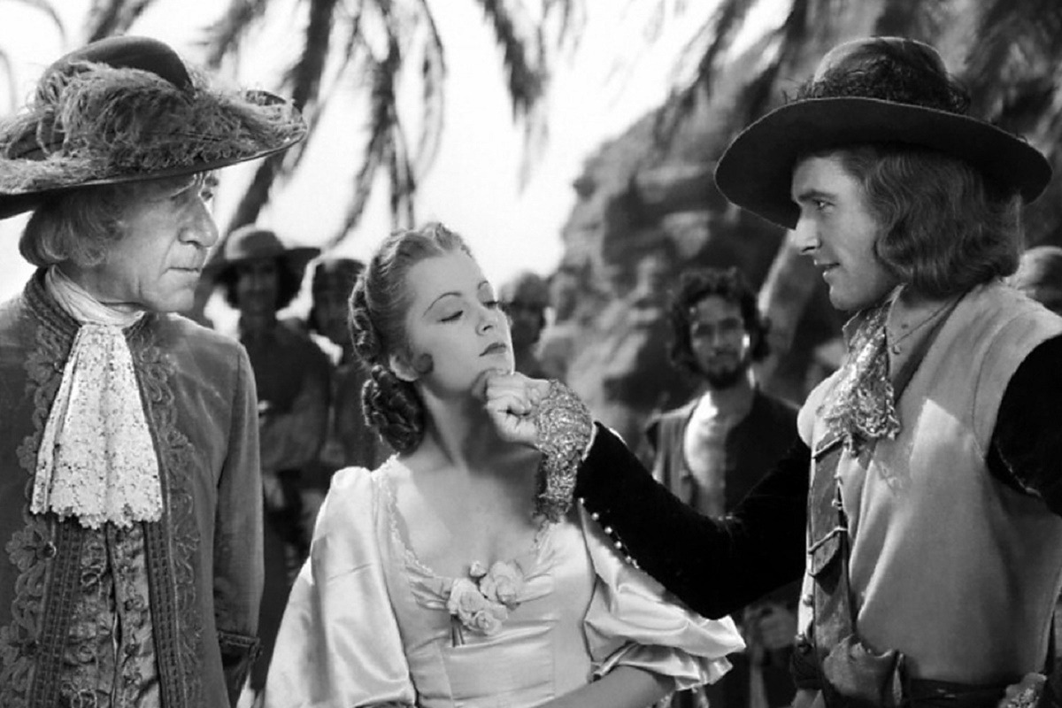 Errol Flynn und Olivia de Havilland in Unter Piratenflagge | © Warner Bros.