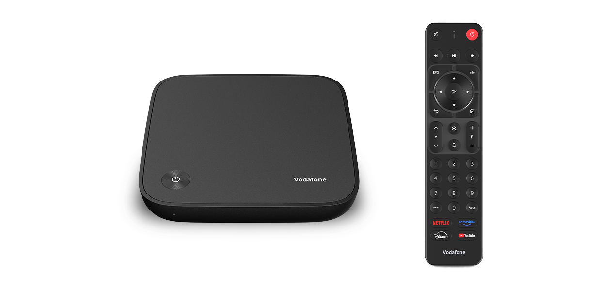 Produktfoto: GigaTV Home Box, daneben die dazugeh&ouml;rige Fernbedienung. Beides in der Ansicht von oben. Beides in Schwarz.